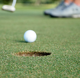 golf ball approaching hole