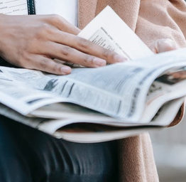 Person reading newspaper