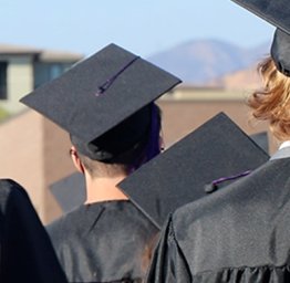 Back of student heads during graduation
