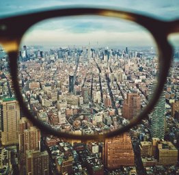 Glasses Lenses Above A City
