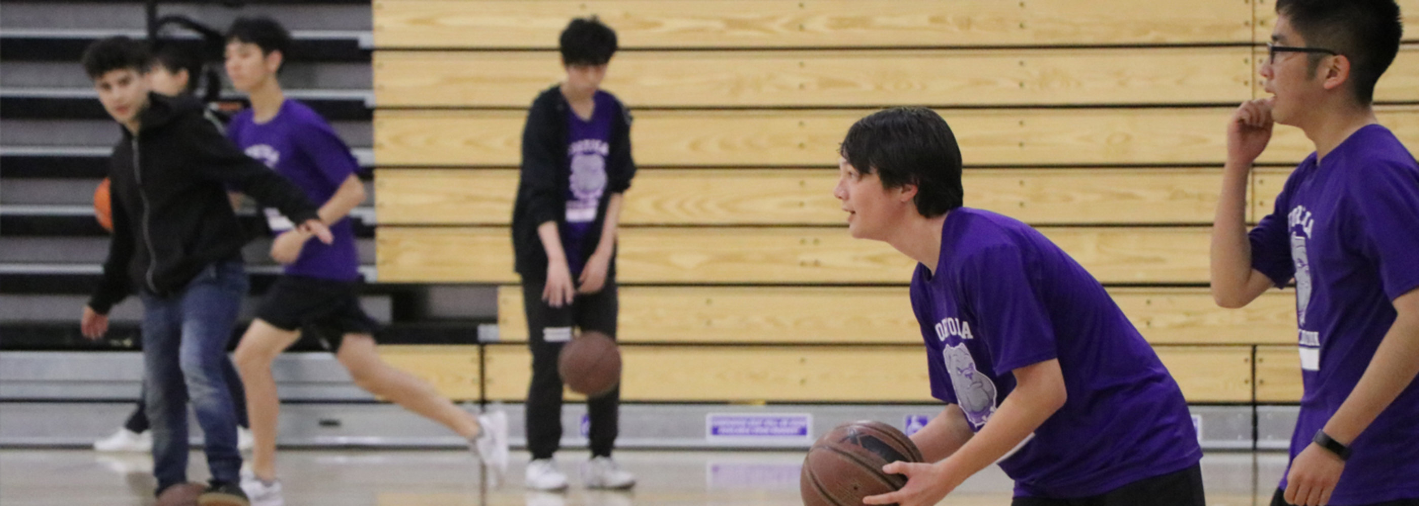 students playing basketball