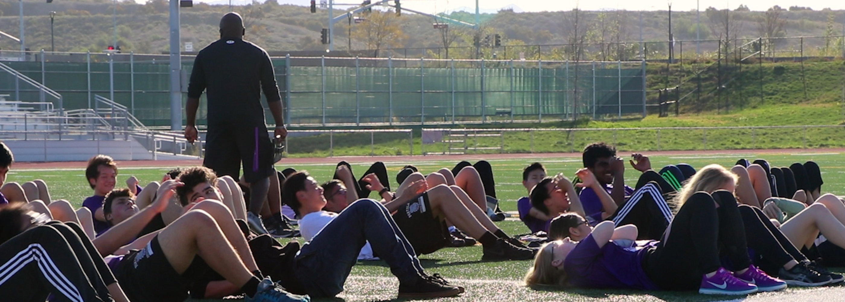 Students doing sit-ups