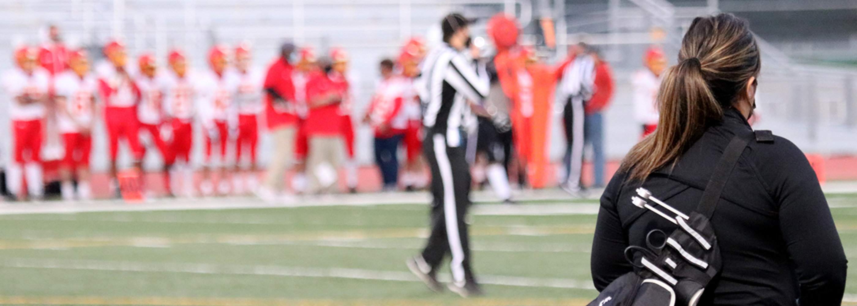 Trainer walking on field