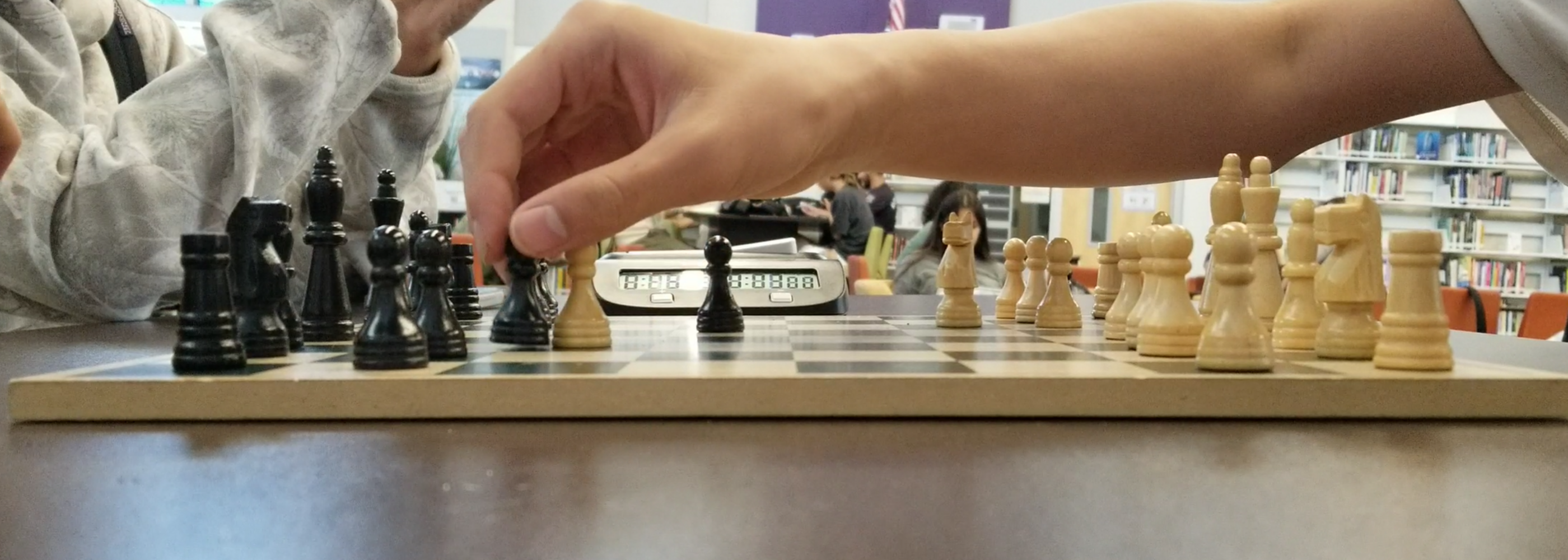 Up close of hands playing chess